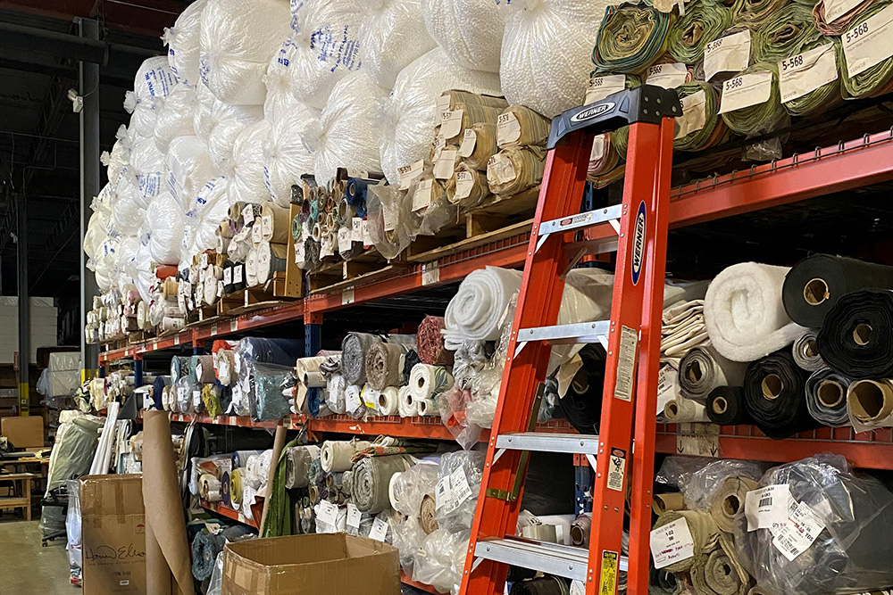 Bunting and fabric samples in a warehouse