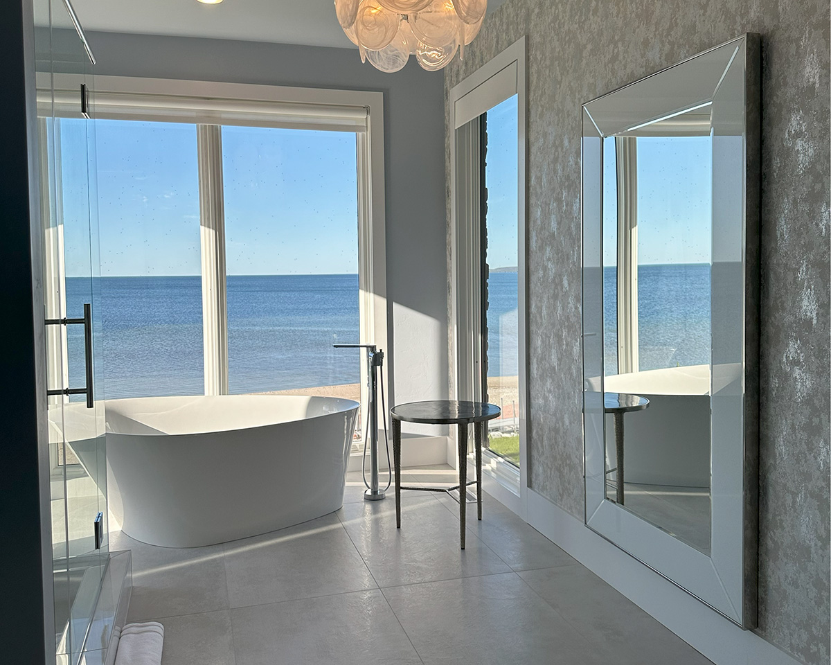 Modern bathroom with ocean view and glass disnk chandelier